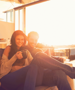 Happy partners practicing new skills learned through couples communication therapy for a stronger, renewed connection