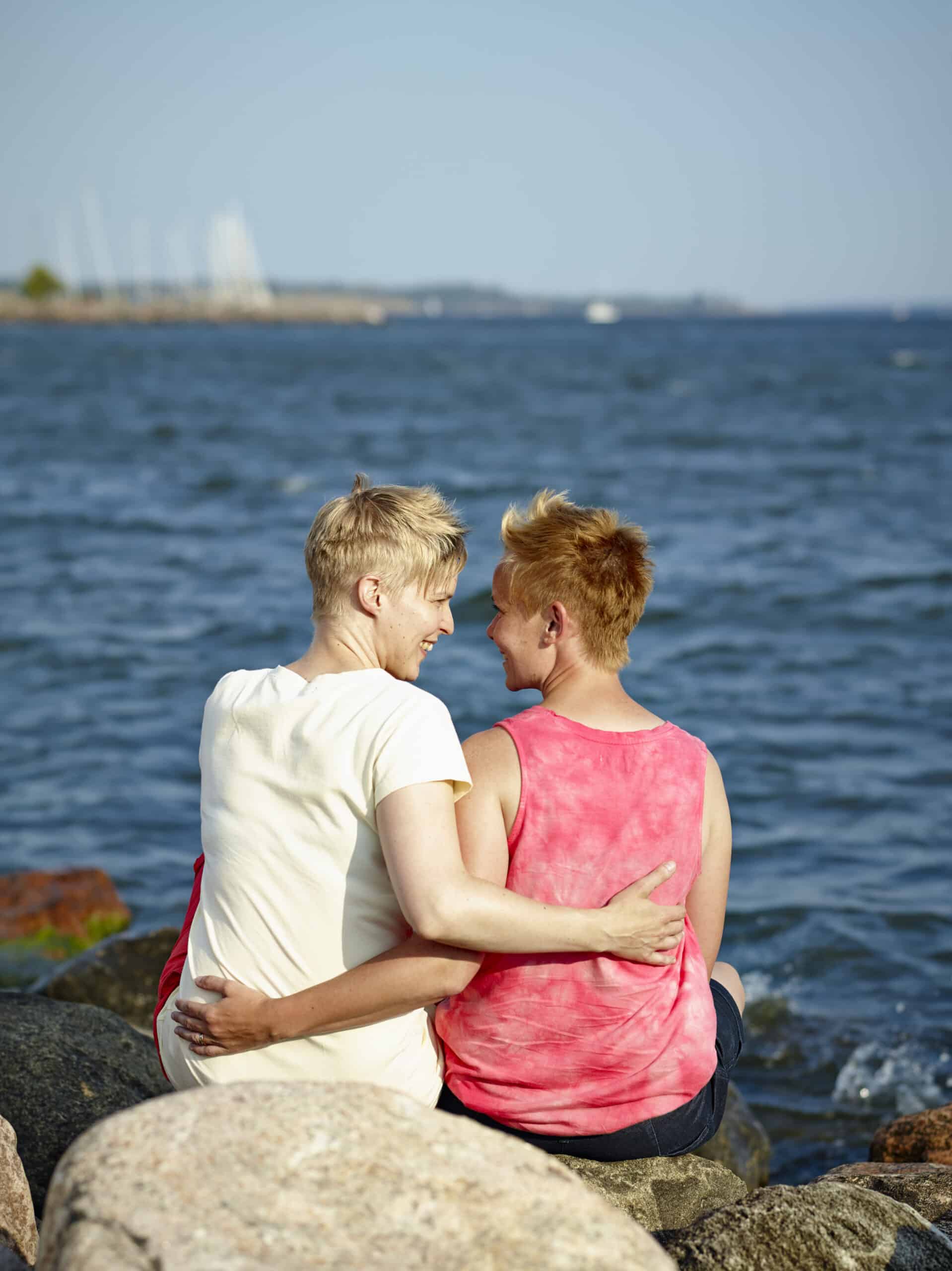 Happy partners reconnected through an expert marriage counselor for couples therapy sessions online and in-person.