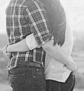 A couple embracing peacefully after successful conflict resolution therapy sessions for lasting harmony