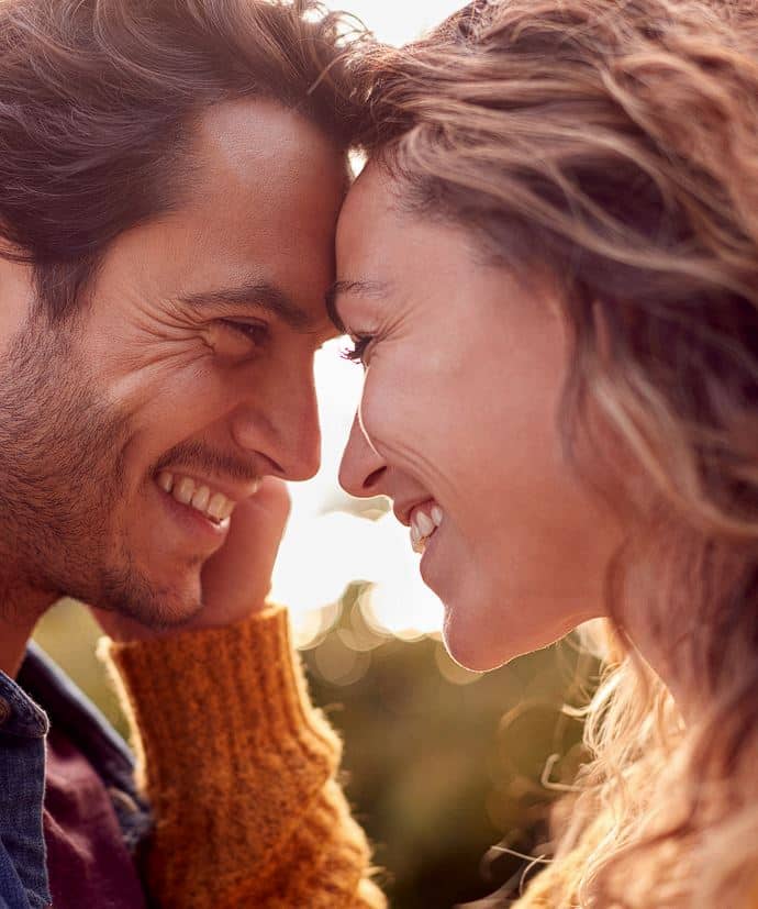 couple happily facing each other