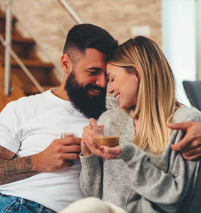 Happy partners reconnected through an expert marriage counselor for couples therapy sessions online and in-person.