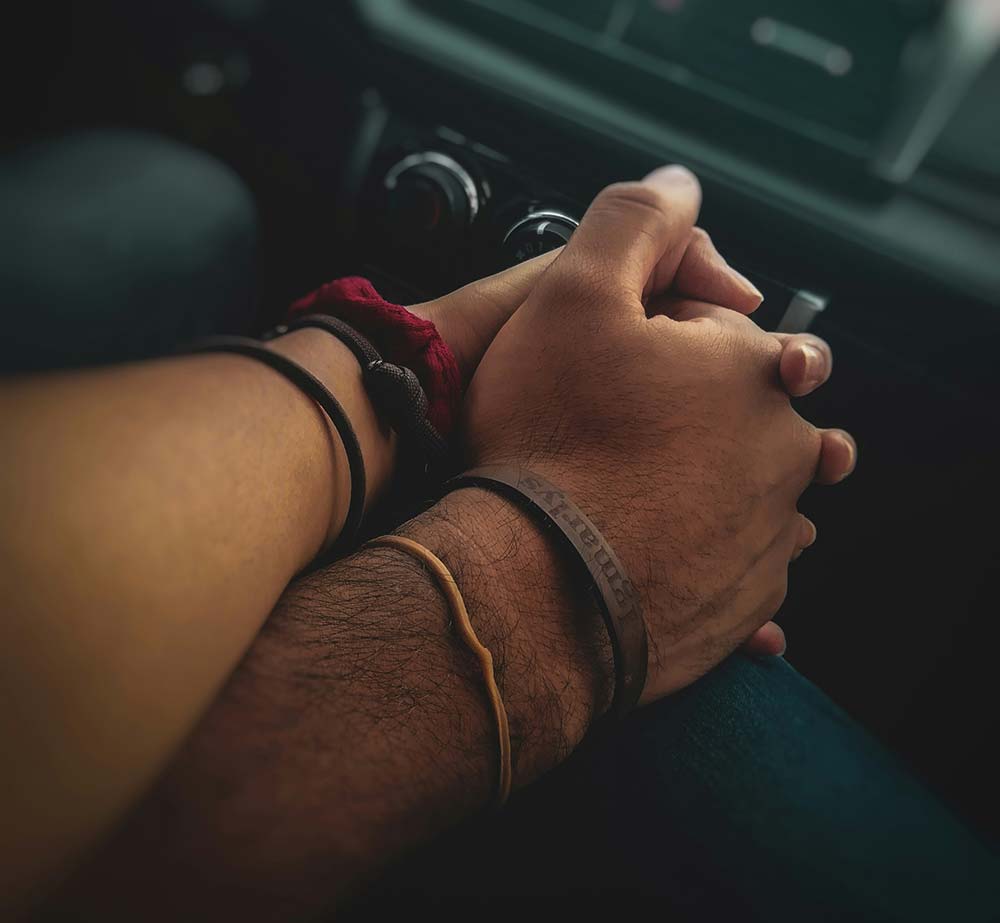 People holding hands together.