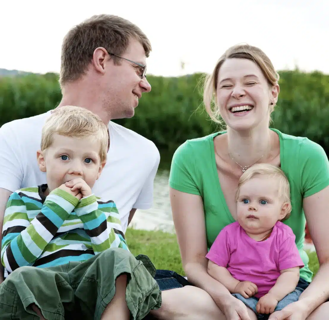 Loving family celebrating marriage and family therapy success with family and marriage counseling