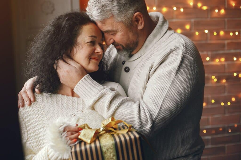 Older married couple sharing a quiet, affectionate moment, symbolizing emotional connection in a long-term marriage.