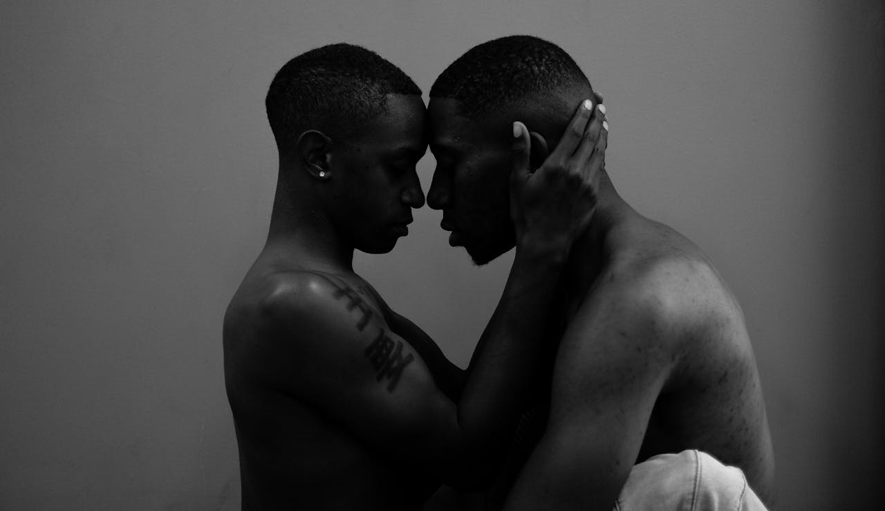 Two partners holding each other closely, symbolizing vulnerability, trust, and emotional intimacy explored in attachment-based sex therapy.