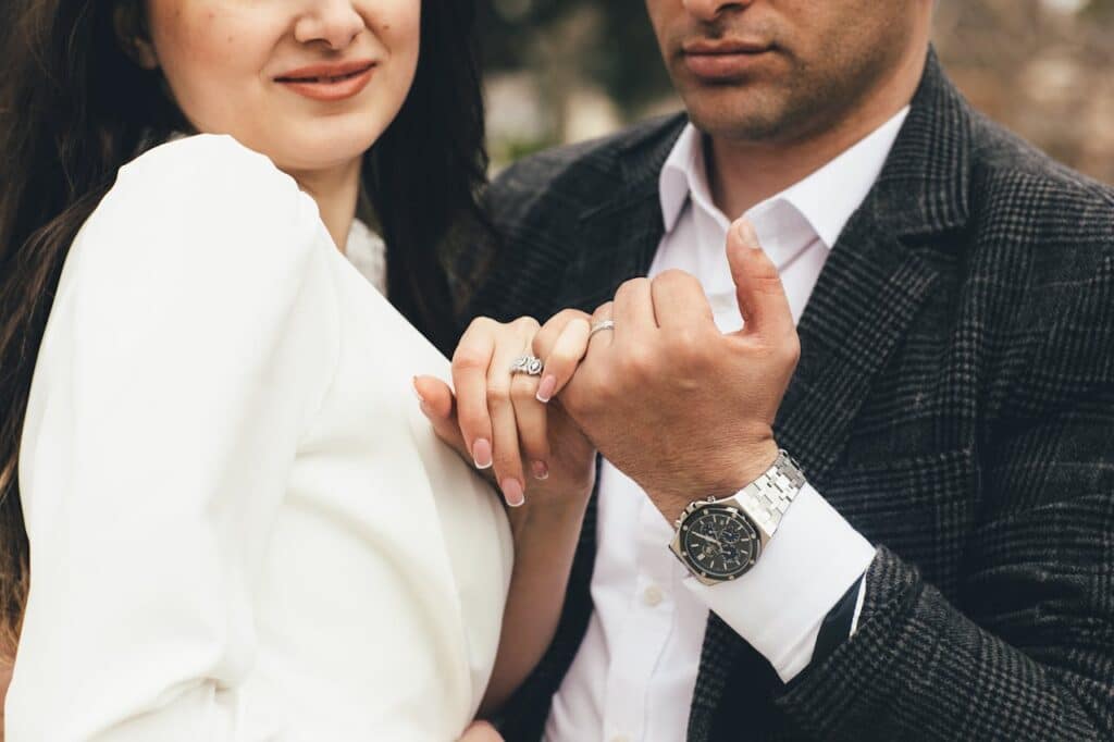 Dallas engaged couple holding hands showing ring, symbolizing premarital power struggles and relationship dynamics