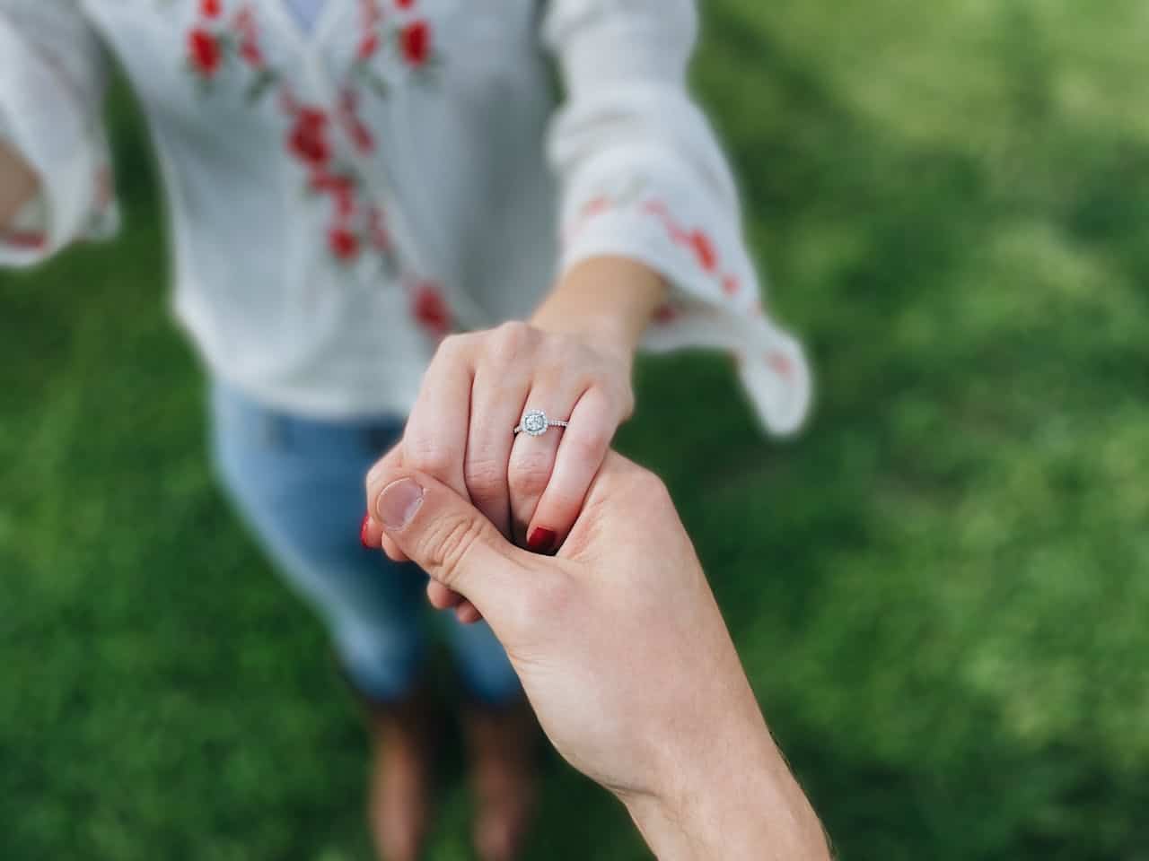 engaged couple holding hands showing ring before marriage emotional connection Austin
